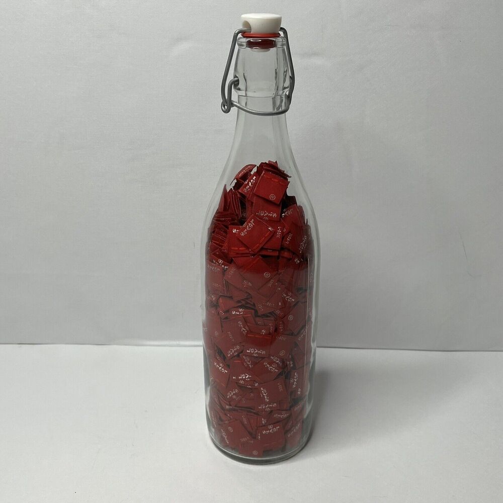 Glass Bottle Filled With 1000+ Tags